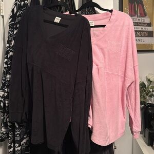 Two pink and black terry cloth long sleeves.
